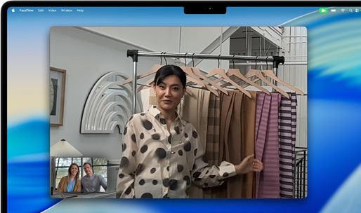 A video call on a MacBook Pro where a woman shows fabrics to two people on the call, with Centre Stage keeping her centred in the frame as she moves around